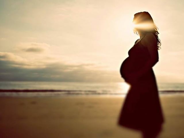 pregnant mother sunset